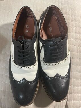 Classic Black and White Wingtip Derby Shoes for Men